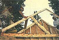 John Bramante (left) and Gus place a truss.